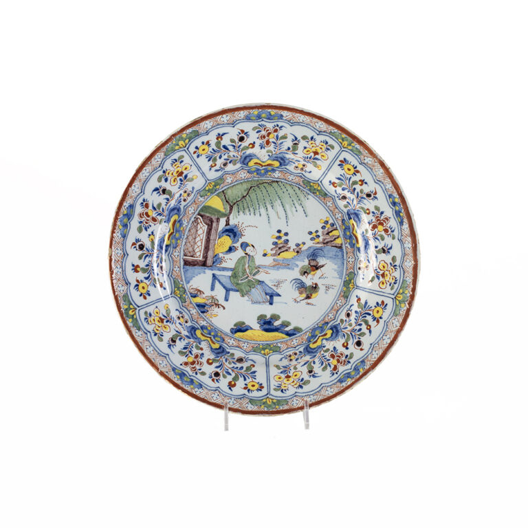 Rare Dutch Polychrome Plate Depicting a Chinese Woman Feeding Chickens in a Landscape 1